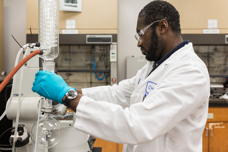 Man working with chemicals in lab